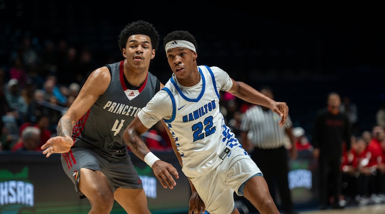 Hamilton’s Elijah Jones is defended by Princeton’s Kam Mercer during their Division I district final game Saturday at Cintas Center. AJ FULLAM / CONTRIBUTED