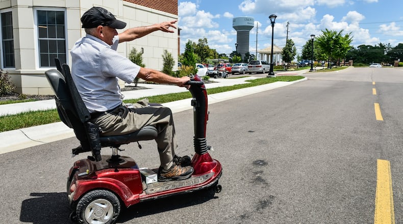 Lynn “Popcorn” Weber rides his scooter around the Otterbein Senior Life campus, where he was a resident in 1959 at Otterbein Childrens Home.