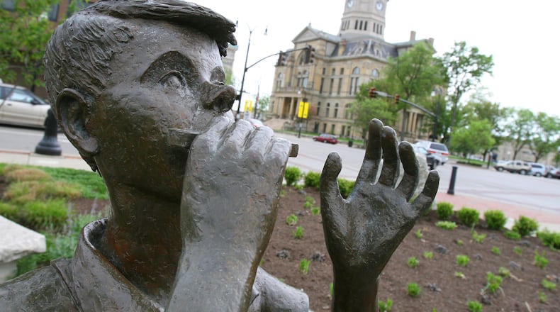 Lentil, a character in Robert McCloskey's first book "Lentil," plays the harmonica for all of downtown Hamilton in Lentil Park.