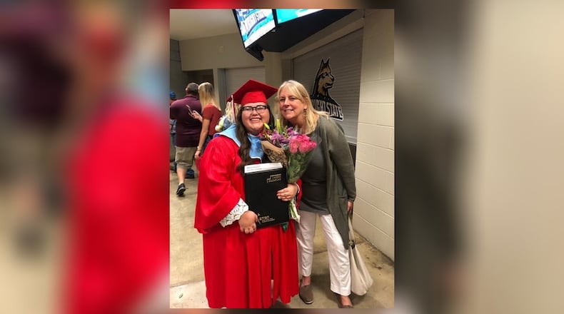 Area teen Alexis Howard and her Big Brother Big Sister mentor Angie Miller share a special moment at Howard’s recent high school graduation at Wright State University’s Nutter Center. Howard was living in Middletown when she began her relationship with her “Big Sis” Miller in 2012. The Butler County Big Brother Big Sister (BBBS) organization has a waiting list of 150 youth wanting to be matched with adults. BBBS officials say most of the public don’t realize the commitment of time by adults is often only a few hours a week.