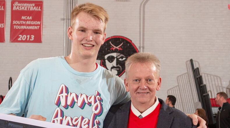 Christian Brothers University senior Adam Dieball (left), shown posing with CBU coach Mike Nienaber, leads the Gulf South Conference in assists with a 6.9 average. PHOTO COURTESY OF CHRISTIAN BROTHERS ATHLETICS