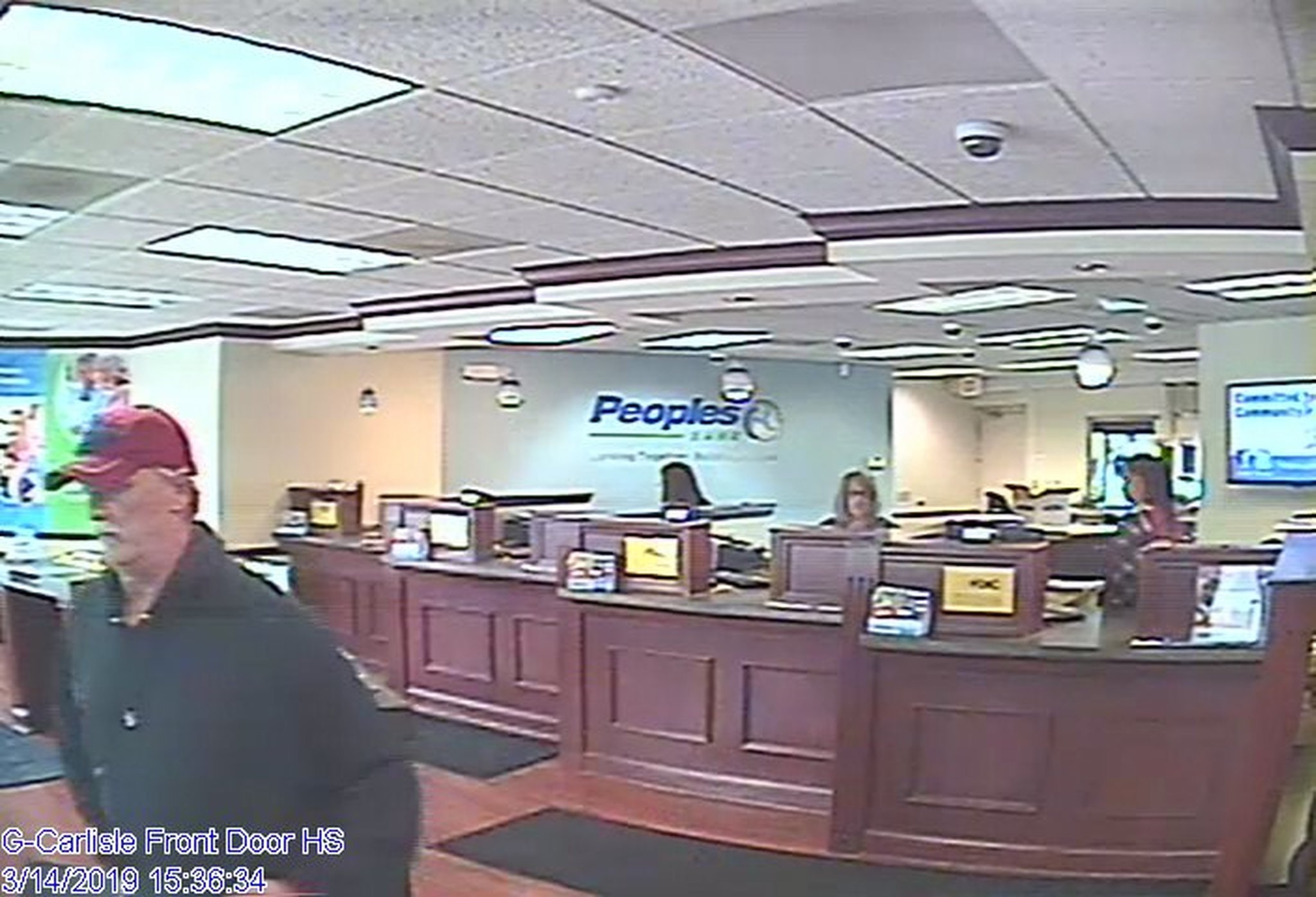 A surveillance camera took a photo of the man believed to have robbed the Peoples Bank branch in Carlisle on March 14, 2019. Carlisle police have identified him as Mark Lunsford, 58, of Hamilton. He is being held on a felony theft/receiving stolen property charge in Dearborn County, Ind. Lunsford is also a person of interest in two 2016 bank robberies in Franklin and Springboro. CONTRIBUTED