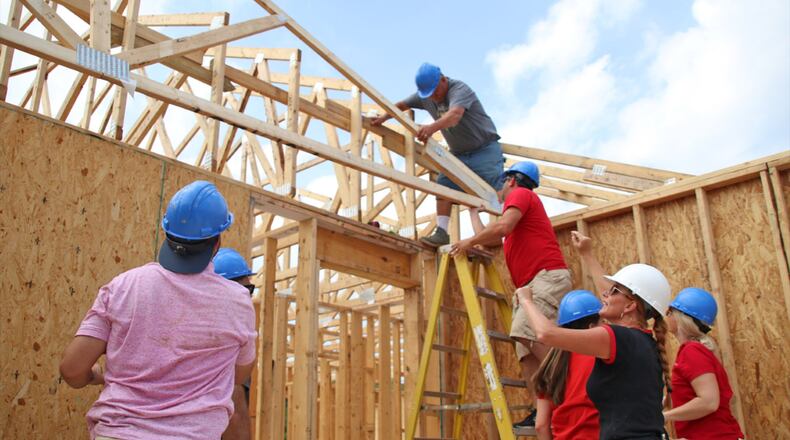 Habitat for Humanity volunteers have been hard at work constructing a new home for Erica Bohannon and her family. Erica has been in the Habitat for Humanity program a couple of years and her family lost their home to the recent tornadoes. BRAD LEE / STAFF