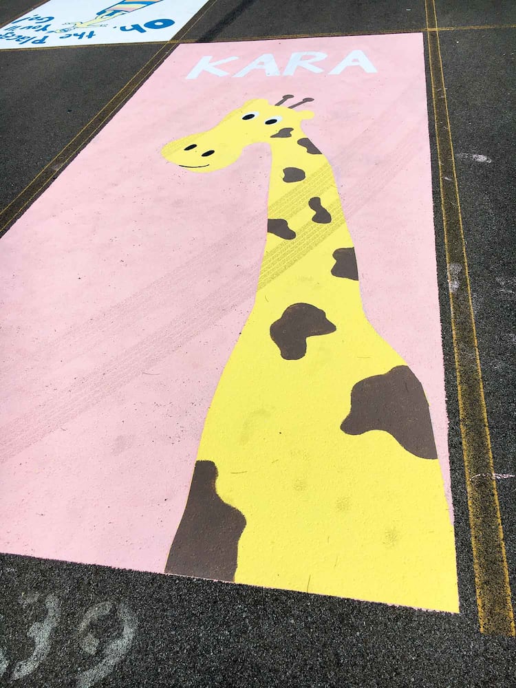 PHOTOS Lakota East seniors paint parking spots