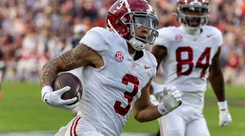 Alabama wide receiver Jermaine Burton (3) runs into the end zone for a pass-reception touchdown against Auburn during the first half of an NCAA college football game, Saturday, Nov. 25, 2023, in Auburn, Ala. (AP Photo/Vasha Hunt)
