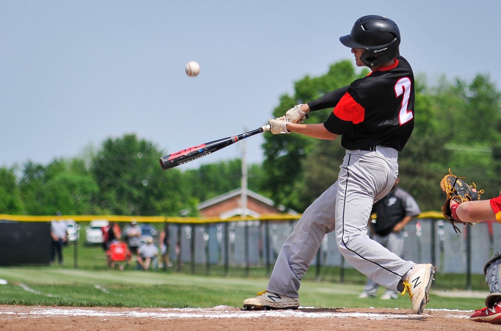 Franklin’s Cooper Daniels makes contact with the ball during Friday’s Division II district baseball final against Fenwick at Miamisburg’s Toadvine Field. Franklin won 11-2. NICK GRAHAM/STAFF