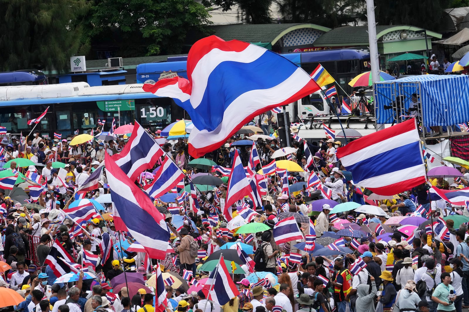Protesters gather at Victory Monument demanding Thailand's Prime Minister Paetongtarn Shinawatra resign in Bangkok, Thailand, Saturday, June 28, 2025. (AP Photo/Sakchai Lalit)