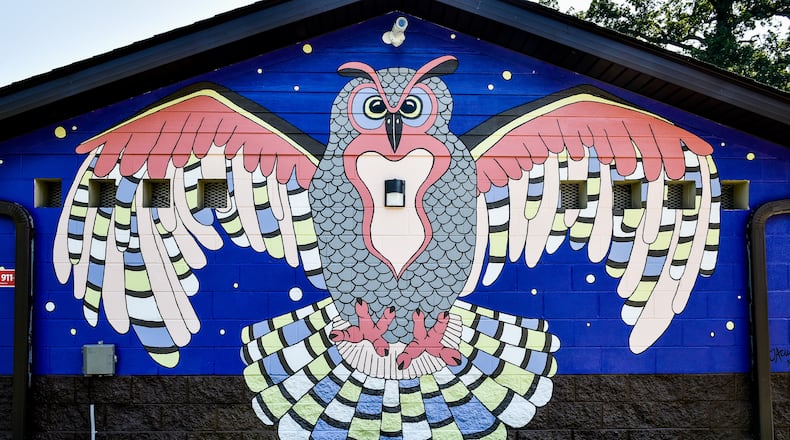 This is one of six bird murals designed and painted by Jenn Acus-Smith with the help of others in Hamilton Parks Conservancy parks in Hamilton. This one is at Millikin Woods Park on North Washington Boulevard. The murals were made possible by an anonymous donation. NICK GRAHAM/STAFF