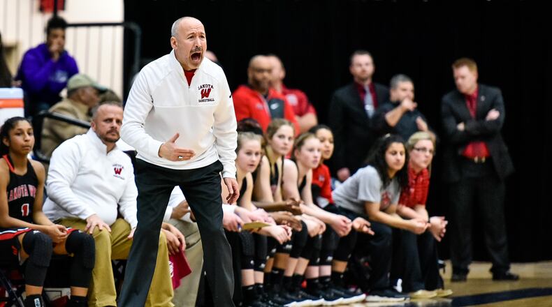 Lakota West coach Andy Fishman in action Wednesday night during the Firebirds’ 60-31 win over Walnut Hills in a Division I regional semifinal at Fairmont’s Trent Arena. NICK GRAHAM/STAFF