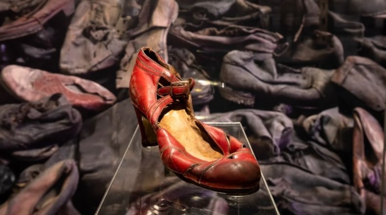 Personal items including shoes, clothing, children’s dolls, eyeglasses and suitcases are part of an "Auschwitz" exhibit at Cincinnati Museum Center's Nancy & David Wolf Holocaust & Humanity Center. CONTRIBUTED
