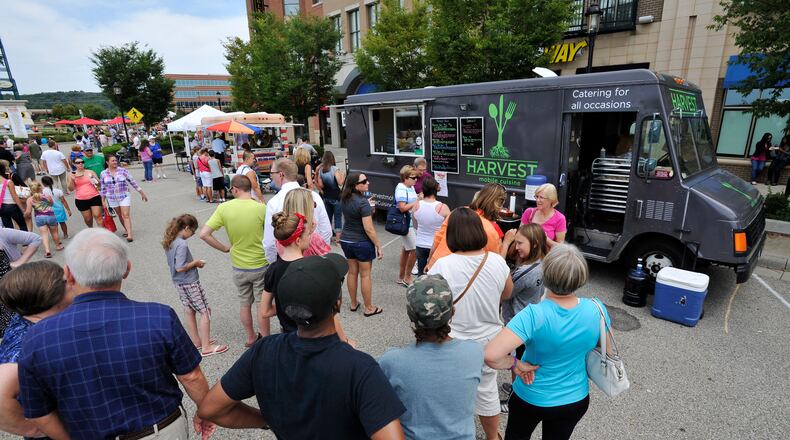 CUTLINE FOR 112115 WC MERCHANTS: Union Centre Boulevard Merchant Association already donates a percentage of profits from its annual Union Centre Food Truck Rally to an area non-profit. It recently gave $11,000 to Reach Out Lakota, a food and clothing pantry serving West Chester and Liberty townships. STAFF FILE PHOTO / 2014