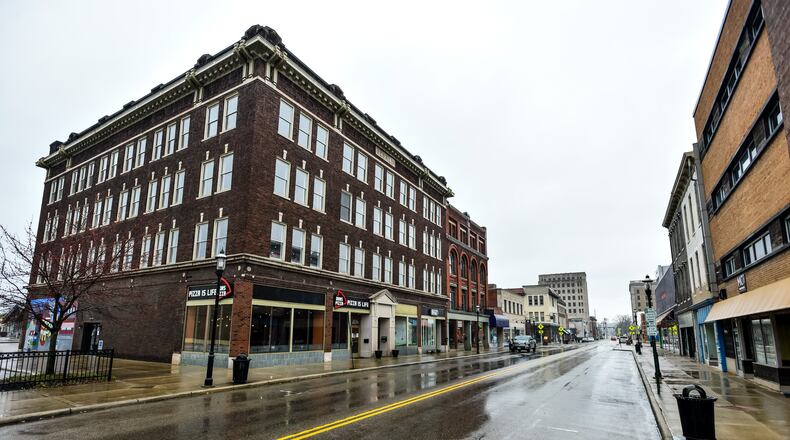 Central Avenue in downtown Middletown has fewer cars parked along the street than normal Wednesday. The state has banned all dine-in food consumption to help reduce the spread of coronavirus and many people are working from home. NICK GRAHAM/STAFF