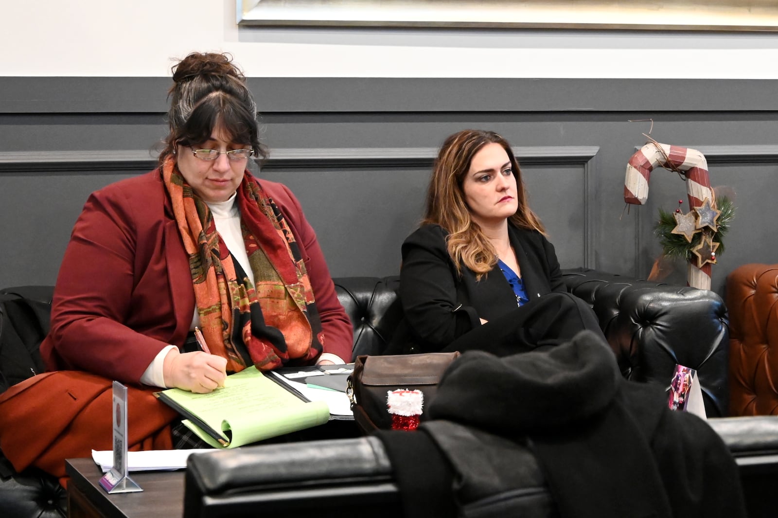 Middletown Mayor Elizabeth Slamka and City Manager Ashely Combs listen to a presentation by Butler County Finance Authority President and CEO Joshua Smith about the revitalization efforts in Hamilton during his tenure as city manager. Middletown leaders are considering a project that would demolish the Manchester Inn and construct a new mixed-use development that would include 100 to 125 apartments and 10,000 to 15,000 square feet of retail space. MICHAEL D. PITMAN/STAFF