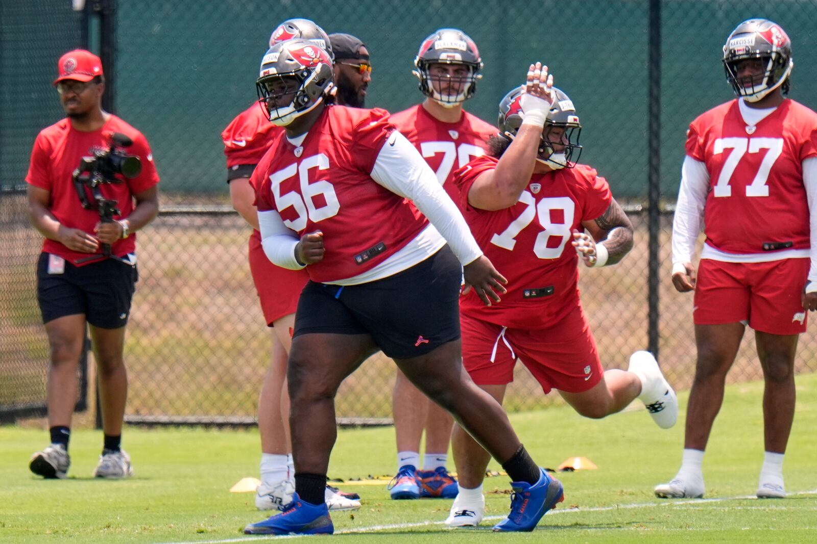 Tampa Bay Buccaneers nose tackle Desmond Watson (56) works against Dvon J-Thomas (78) during the NFL football team's rookie minicamp Friday, May 9, 2025, in Tampa, Fla. (AP Photo/Chris O'Meara)
