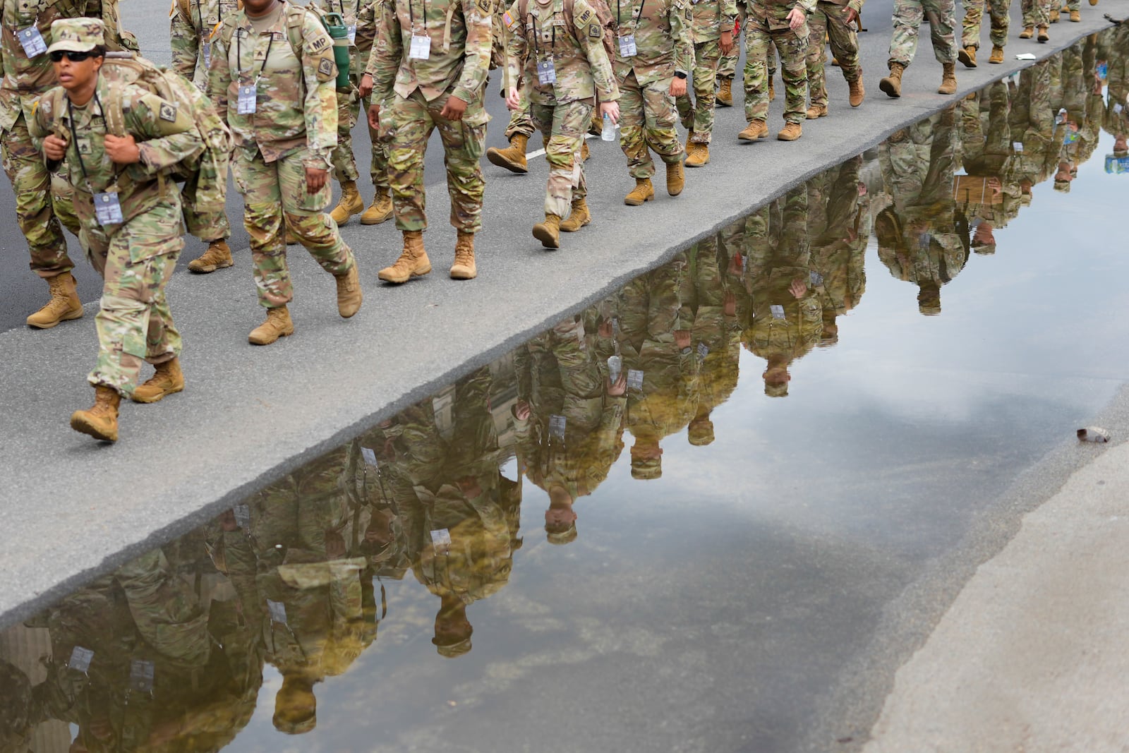 U.S. Army soldiers walking along Constitution Ave., on the National Mall ahead of a parade commemorating the Army's 250th anniversary and coinciding with President Donald Trump's 79th birthday, Saturday, June 14, 2025, in Washington. (AP Photo/Pablo Martinez Monsivais)
