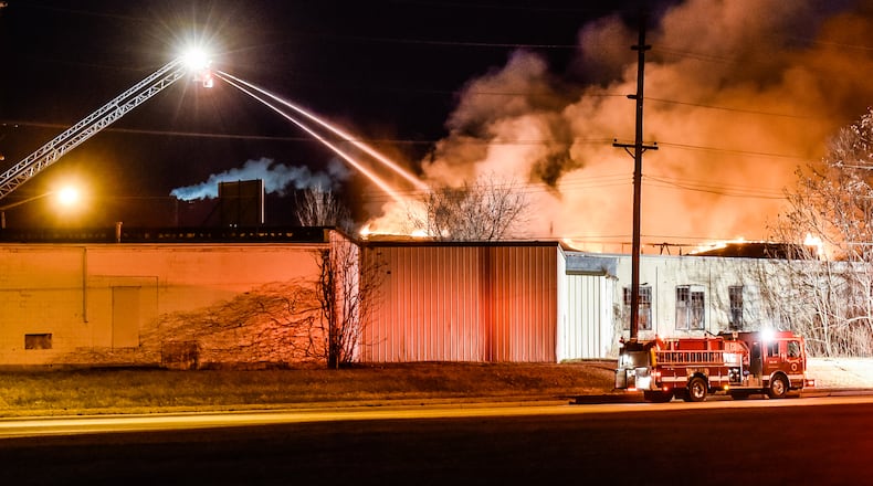 Fire crews from multiple departments battle a fire in the former Middletown Paperboard building on Verity Parkway Friday, Feb. 2 in Middletown. NICK GRAHAM/STAFF