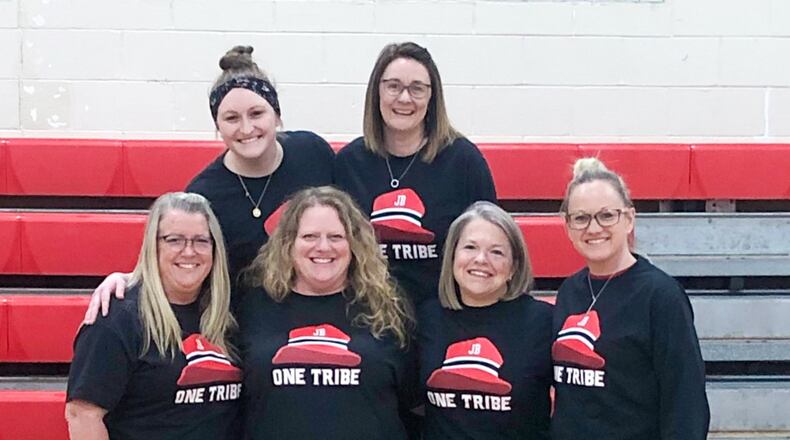 Crossroads school staff are pictured in the "Super Fan Jim" shirts are Debbie McCune, school nurse; Jen Crawley, EL teacher; Shannon Cupp, assistant principal; Francine Ross, secretary; Shannon Jarvis, educational assistant, and Jenni Meier, physical education teacher. CONTRIBUTED