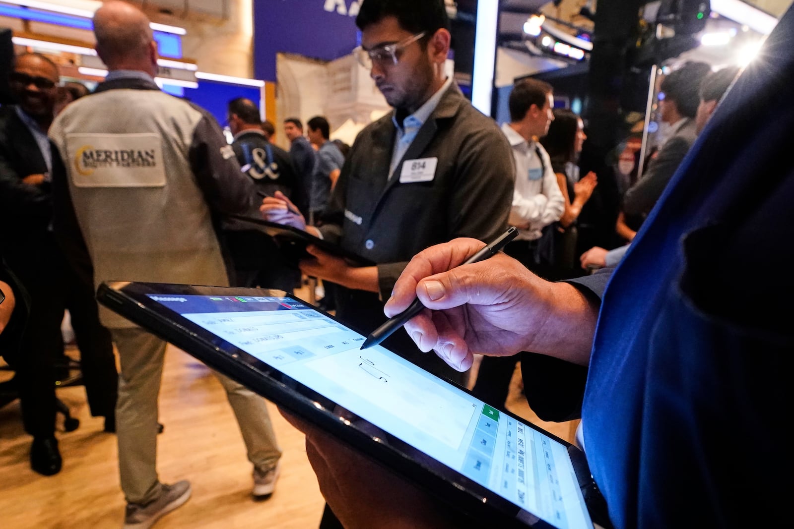 Traders workon the floor of the New York Stock Exchange, Monday, June 23, 2025. (AP Photo/Richard Drew)