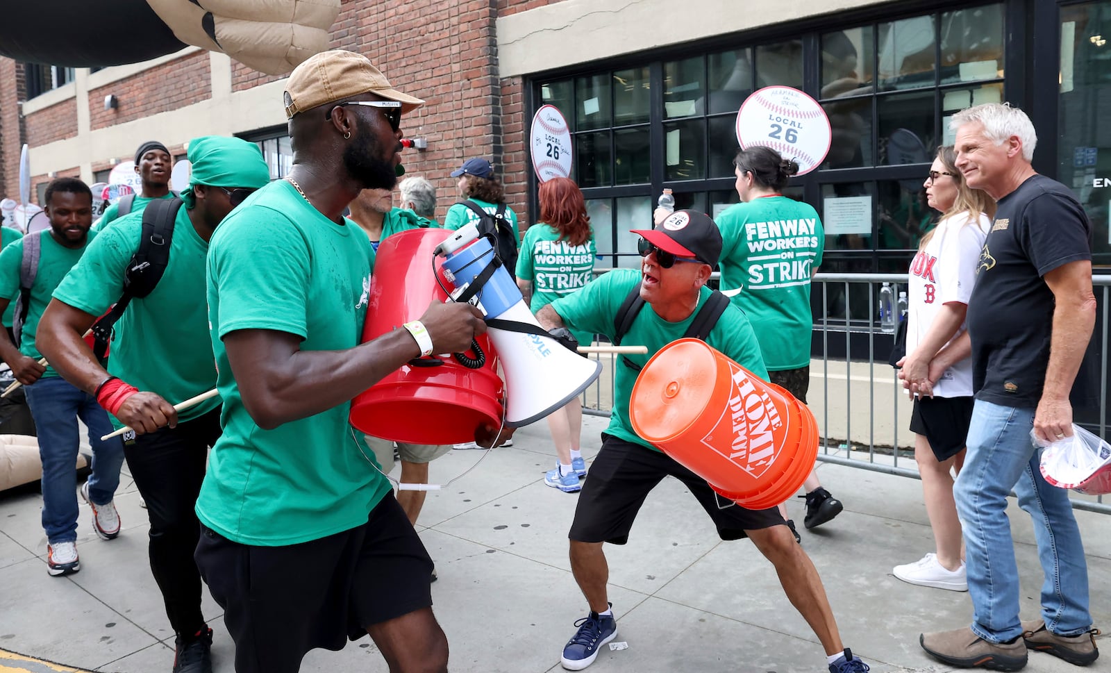 Concession workers from Fenway Park picket outside the ballpark Friday, July 25, 2025, in Boston before a baseball game between the Boston Red Sox and the Los Angeles Dodgers. (AP Photo/Mark Stockwell)