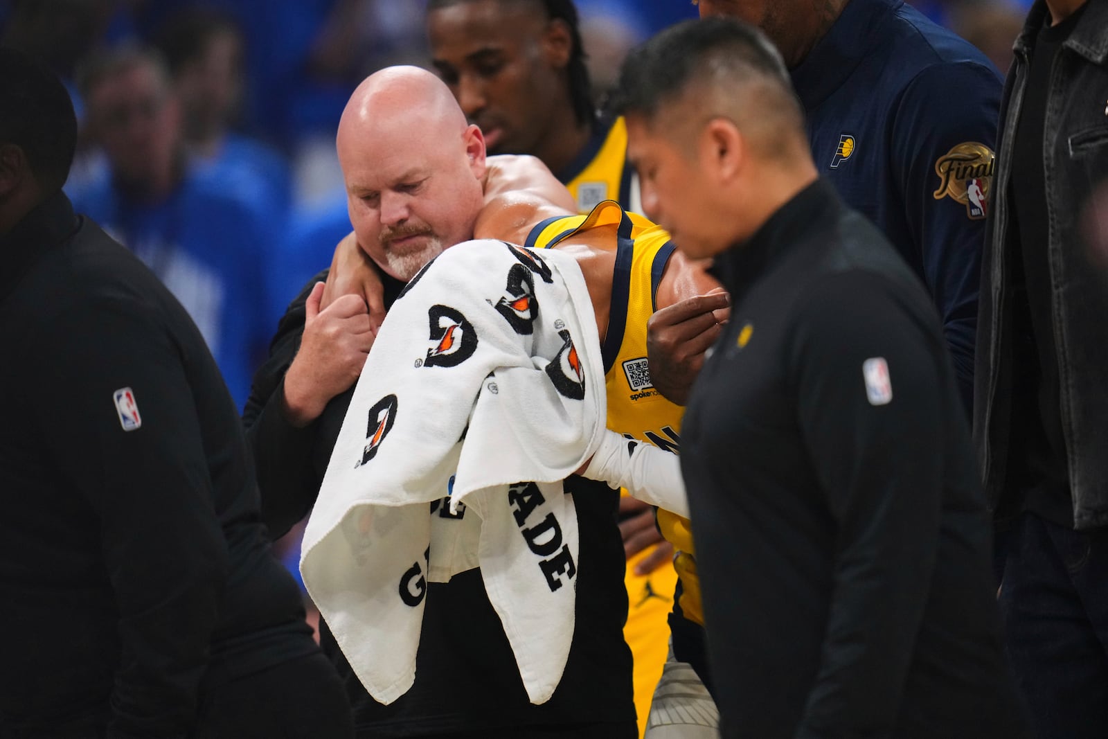 Indiana Pacers guard Tyrese Haliburton (0) leaves the court with an injury during the first half of Game 7 of the NBA Finals basketball series against the Oklahoma City Thunder Sunday, June 22, 2025, in Oklahoma City. (AP Photo/Julio Cortez)