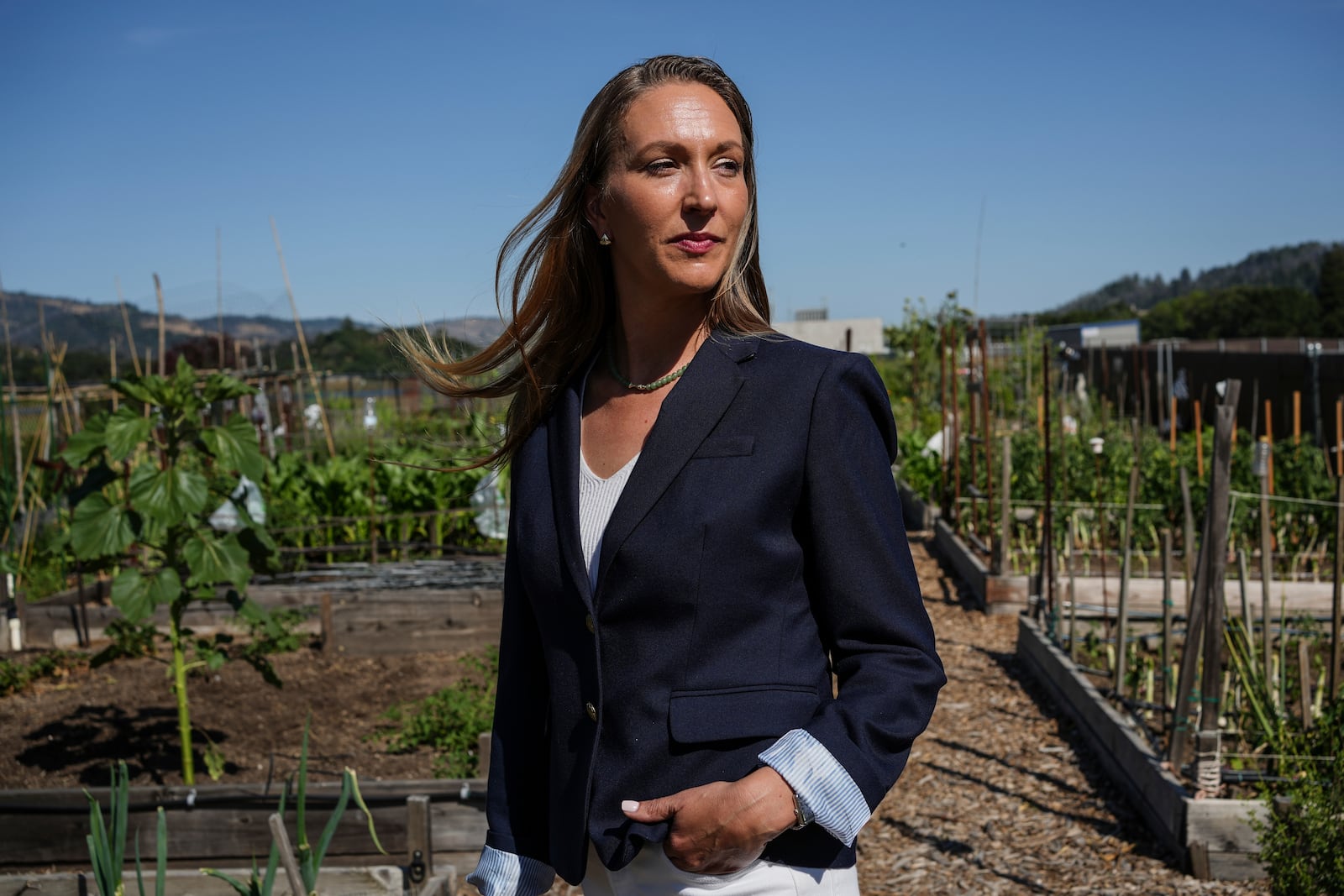 Calistoga resident and City Council member Lisa Gift poses for a portrait Tuesday, May 27, 2025, at the community garden in Calistoga, Calif. (AP Photo/Annika Hammerschlag)