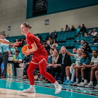 Miami University's Amber Scalia prepares to drive past a Chanticleers defender during their game at Coastal Carolina on Monday, Nov. 3 at The HTC Center. The RedHawks won 63-53. MIAMI ATHLETICS