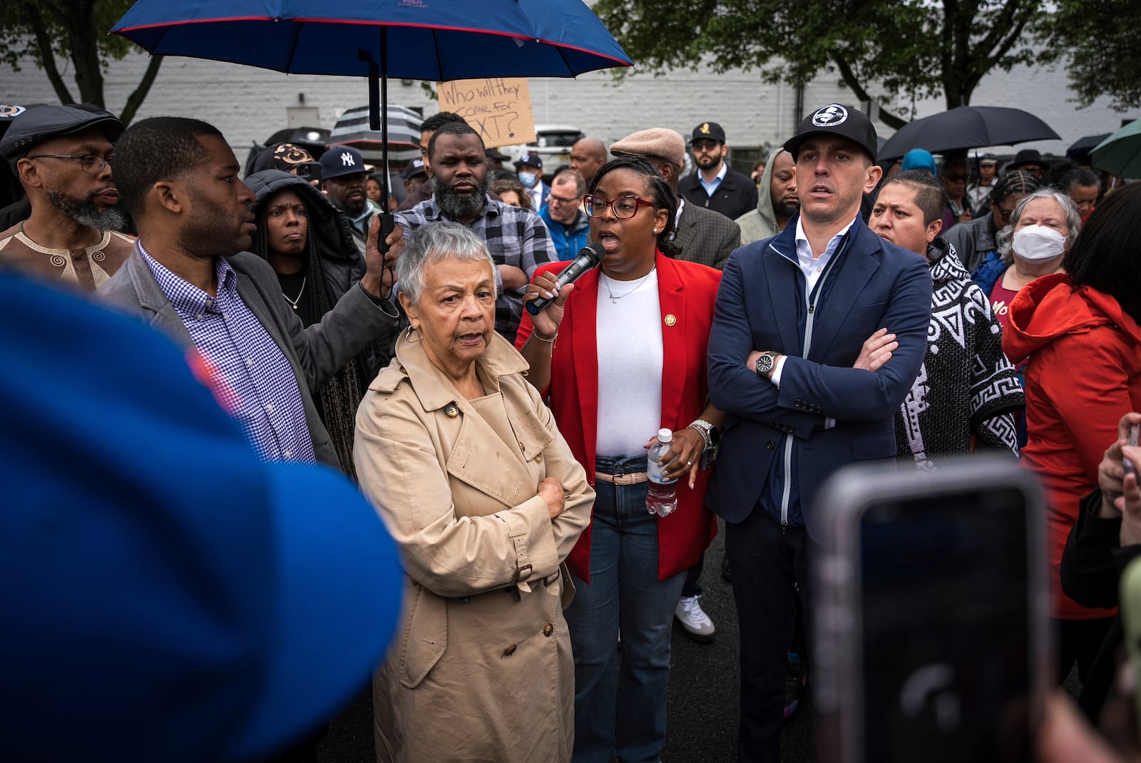 Rep. LaMonica McIver, center, demands the release of Newark Mayor Ras Baraka after his arrest while protesting outside an ICE detention prison, Friday, May 9, 2025, in Newark, N.J, (AP Photo/Angelina Katsanis)