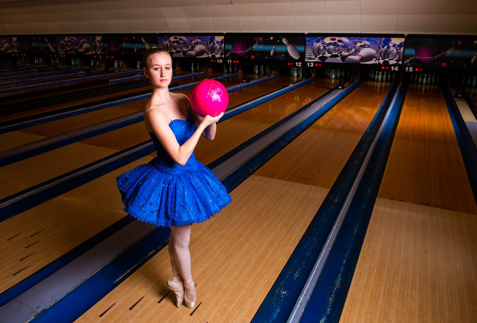 Clare Sherman, 15, with Miami Valley Ballet Theatre, poses for a photo at Pohlman Lanes and Family Entertainment Complex on Pyramid Hill Blvd. in Hamilton.
  Hamilton’s very own Miami Valley Ballet Theatre dancers are trading out their ballet slippers for bowling shoes, for a very special performance at Pohlman Lanes. Their brand new show is a Fab Four inspired production featuring the music of the Beatles that features an exciting mix of contemporary and modern dance. The Ballet, Beatles and Bowling show is part of Fitton Center's "Outside The Box" series showcasing live arts at around Hamilton. The performance is Sunday, April 11 from 3-5 p.m. NICK GRAHAM / STAFF 