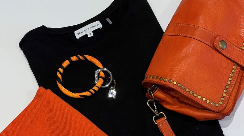 Get Dressed fashion boutique in Oakwood leans into the Bengals motif this week with sweaters, handbags, accessories and more. Contributed photo