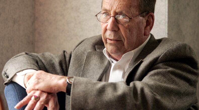 In this 2006 file photo, Russell Dwyer, a former Middletown police chief, answers questions during an interview at the WPFB radio station in Middletown. Dwyer was a news reporter for the local station.