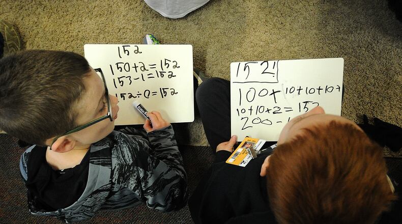 First-grade students in Sarah Jacobs math class work on  addition and subtraction skills Monday, April 22, 2024 at the Primary Village North school in Centerville. A proposed bill would allow military families to enroll in almost any Ohio public school. MARSHALL GORBY\STAFF