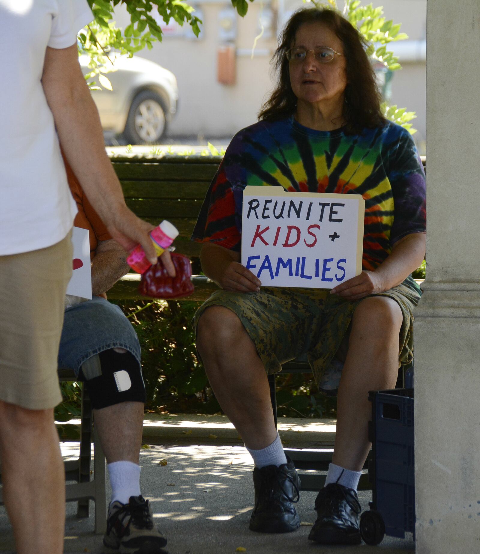 A protester holds a sign on Saturday, June 30, 2018, at Memorial Park in Uptown Oxford during a rally protesting President Donald Trump’s immigration policy where migrant children were separated from their families as they crossed the U.S.-Mexico border over the past several weeks. Trump has since signed an order directing that families not be separated, though thousands are still separated, according to national media reports. MICHAEL D. PITMAN/STAFF
