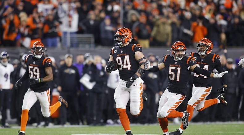 Bengals defensive lineman Sam Hubbard returns a fumble for a 98-yard touchdown against the Ravens at Paycor Stadium on Jan. 15, 2023. Nick Graham/STAFF