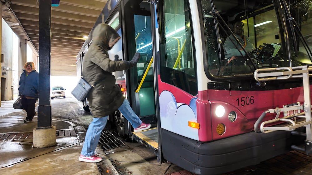 A Butler County Regional Transit Authority bus makes a stop to drop off and pick up riders Wednesday, Dec. 10, 2025 in Hamilton. Butler County commissioners have approved an annual contribution to BCRTA's job shuttle as part of spending federal funding. NICK GRAHAM/STAFF