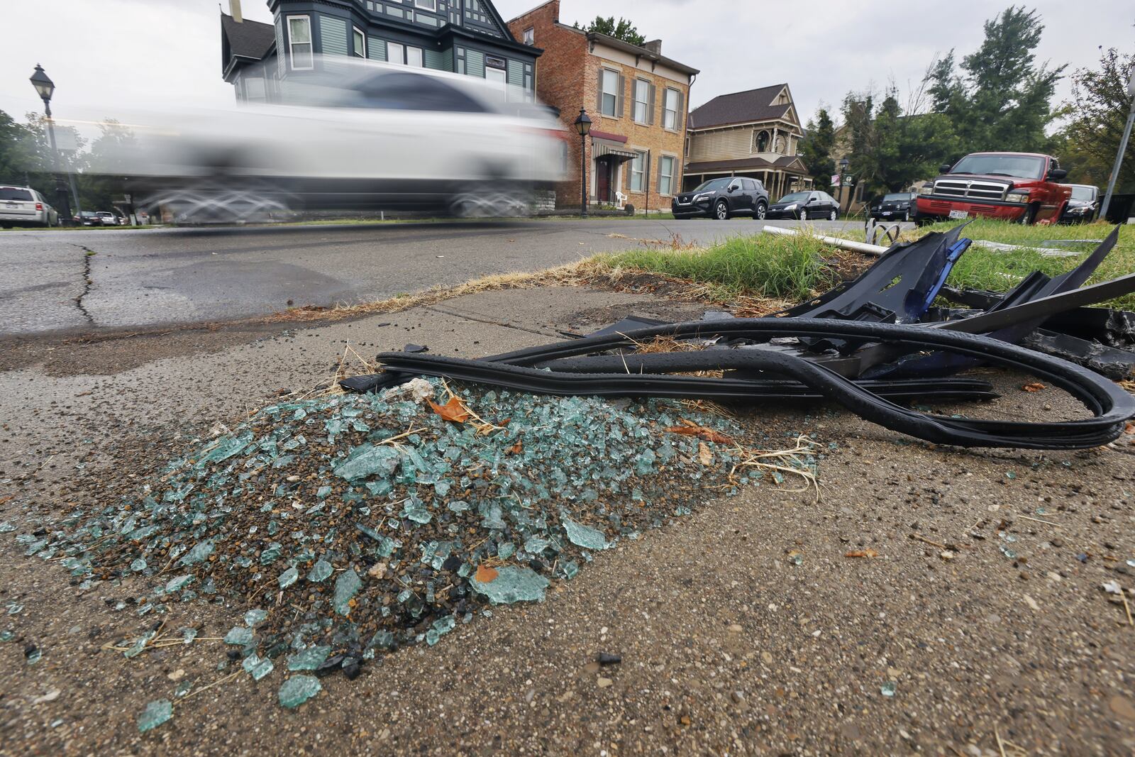 Residents in the area of Ross Ave. and S. B street in Hamilton have voiced their concerns about cars speeding through the area. Several crashes have occurred on those streets recently. Cars are blurred as they travel by remnants of a crash that occurred on Ross Ave. NICK GRAHAM / STAFF