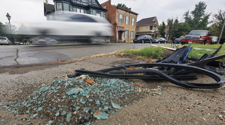 Residents in the area of Ross Ave. and S. B street in Hamilton have voiced their concerns about cars speeding through the area. Several crashes have occurred on those streets recently. Cars are blurred as they travel by remnants of a crash that occurred on Ross Ave. NICK GRAHAM / STAFF