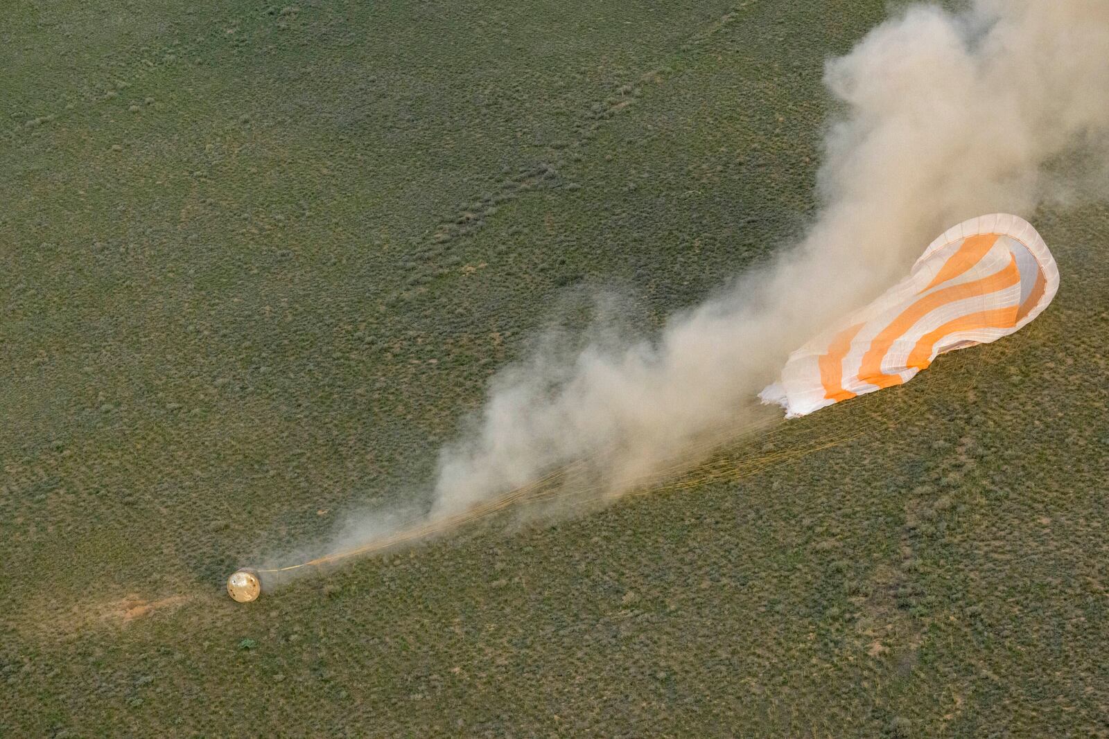 The Soyuz MS-26 spacecraft lands in a remote area near the town of Zhezkazgan, Kazakhstan, with NASA astronaut Don Pettit and Roscosmos cosmonauts Alexey Ovchinin and Ivan Vagner aboard, Sunday, April 20, 2025. (Bill Ingalls/NASA via AP)