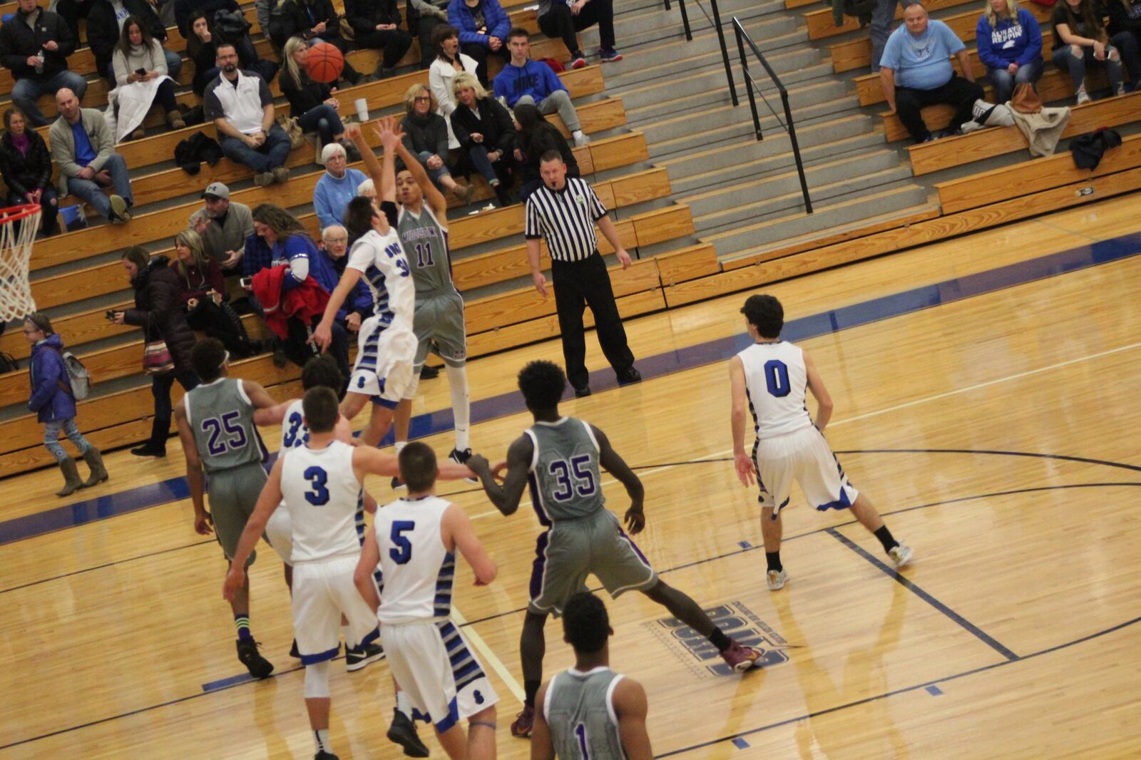 Middletown’s Cliff Snow (11) shoots from long range over Springboro’s Trey Varinsky (30) on Saturday night at SHS. CONTRIBUTED PHOTO BY MARITZA MCKINNEY