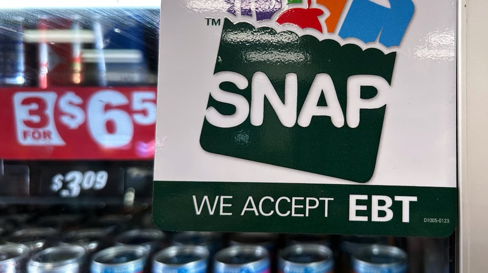 FILE - SNAP EBT information sign is displayed at a gas station in Riverwoods, Ill., Saturday, Nov. 1, 2025. (AP Photo/Nam Y. Huh, file)