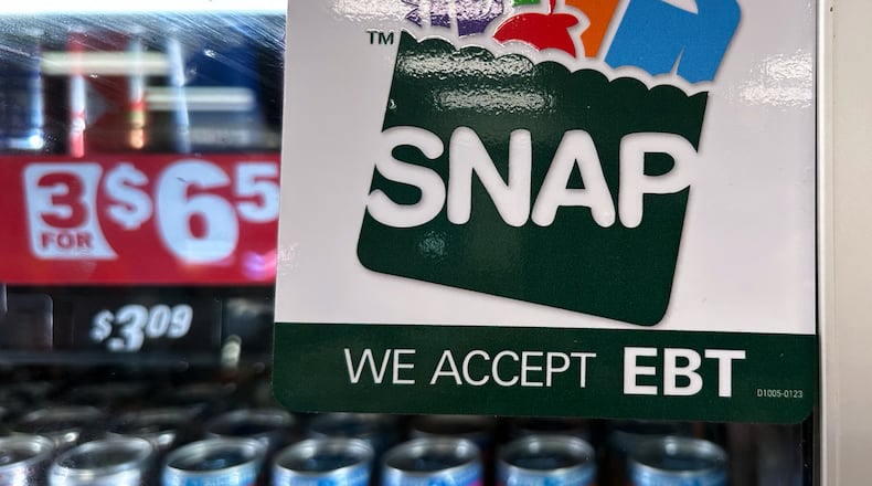 FILE - SNAP EBT information sign is displayed at a gas station in Riverwoods, Ill., Saturday, Nov. 1, 2025. (AP Photo/Nam Y. Huh, file)