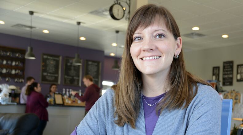 Coffee Cup Overflowing in Fairfield Twp. has become a home to various ministries, businesses and groups, and owner Angie Payne wants her coffee shop to expand upon the community center atmosphere she’s created. MICHAEL D. PITMAN/STAFF