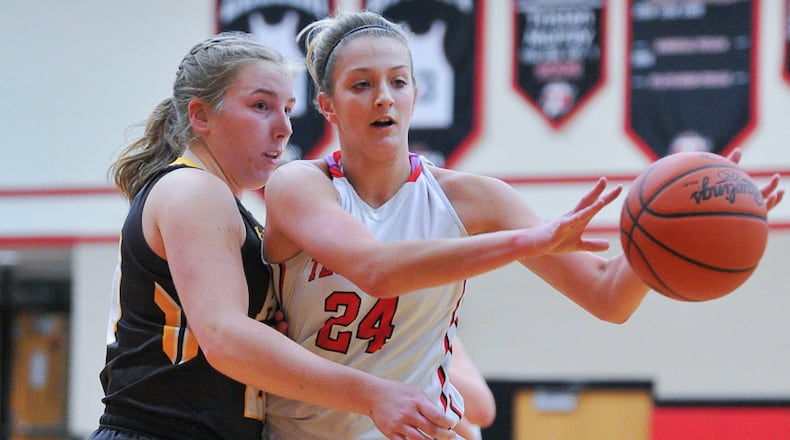 Tecumseh’s Presley Griffitts passes with pressure from Alter’s Emily Long during a nonconference game on Monday night at Reynolds Gymnasium. Bryant Billing/Contributed
