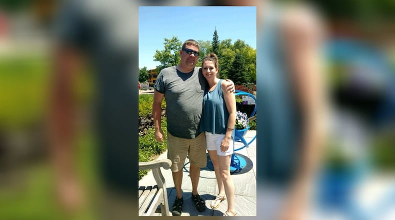 Jason Roberts and his wife, Branden, enjoy a trip to Kings Island. CONTRIBUTED
