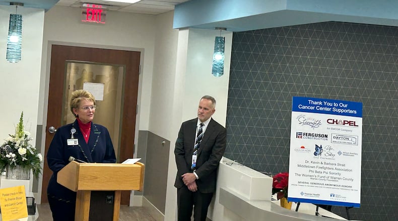 Diane Pleiman, president and CEO of Premier Physicians Network, talks Thursday afternoon about the expansion of the Premier Blood and Cancer Center and the Miami Valley Infusion Center while Kevin Harlan, president of Atrium Medical Center and Upper Valley Medical Center, listens. CONTRIBUTOR/RICK McCRABB