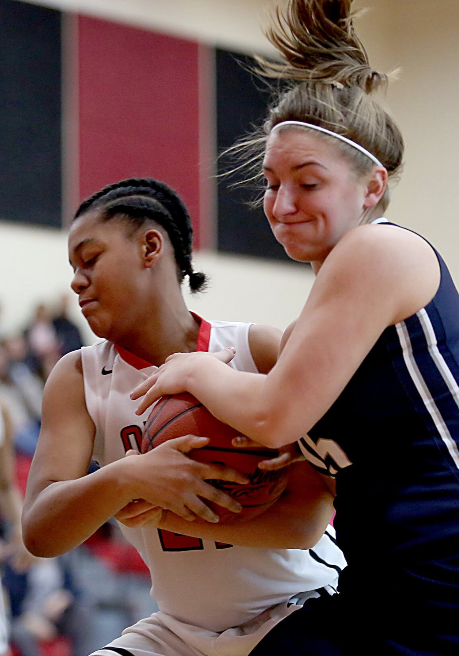 Mt. Healthy’s Kimara Richard (left) and Edgewood’s Kayla Curtis battle for a rebound during Saturday afternoon’s game at Mt. Healthy. CONTRIBUTED PHOTO BY E.L. HUBBARD