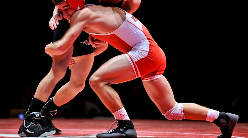 Fairfield’s Zach Shupp (right) competes against Lakota East’s Christian Chavez during a dual match Jan. 14, 2016, at Fairfield High School’s Performing Arts Center. NICK GRAHAM/STAFF