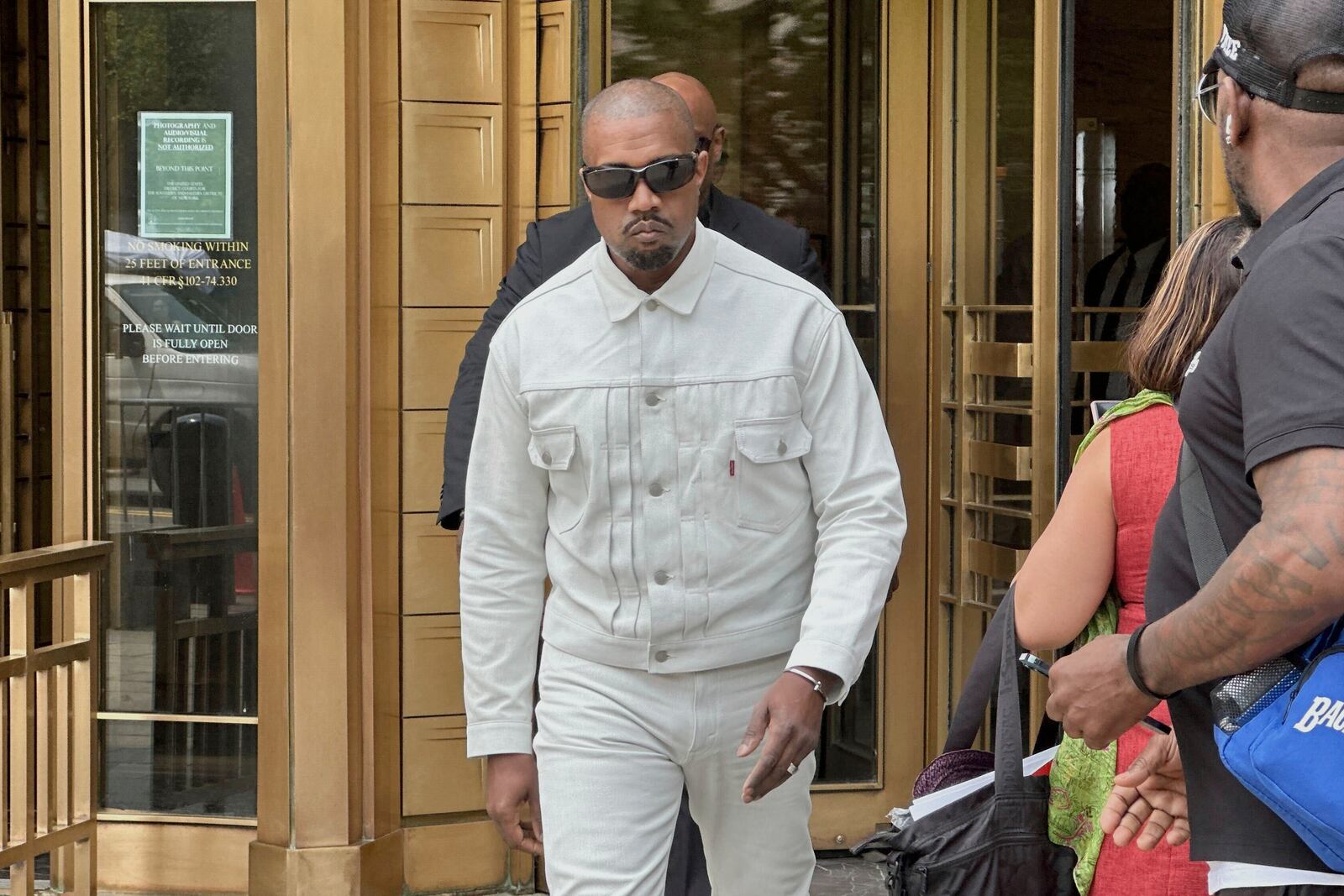 Ye, the rapper formerly known as Kanye West, leaves federal court during the trial of Sean "Diddy" Combs in New York, Friday, June 13, 2025. (AP Photo/Michael R. Sisak)