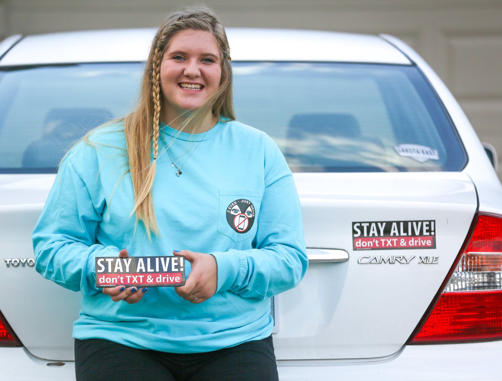 Lakota East High School senior Sarah Strack has created a campaign to help her peers and others understand the deadly consequences of texting while driving. Her uncle died in a car crash involving a driver distracted by texting. GREG LYNCH / STAFF