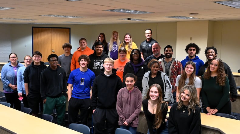 Pictured are students, teachers and staff at Hamilton High School involved in the Butler County high school's house system. Hamilton High School, which houses grades 10 through 12, has implemented a schoolhouse system for its over 800-student body. The house system helps create a smaller community within a large school, and develops community partnerships, such as with local businesses. MICHAEL D. PITMAN/STAFF