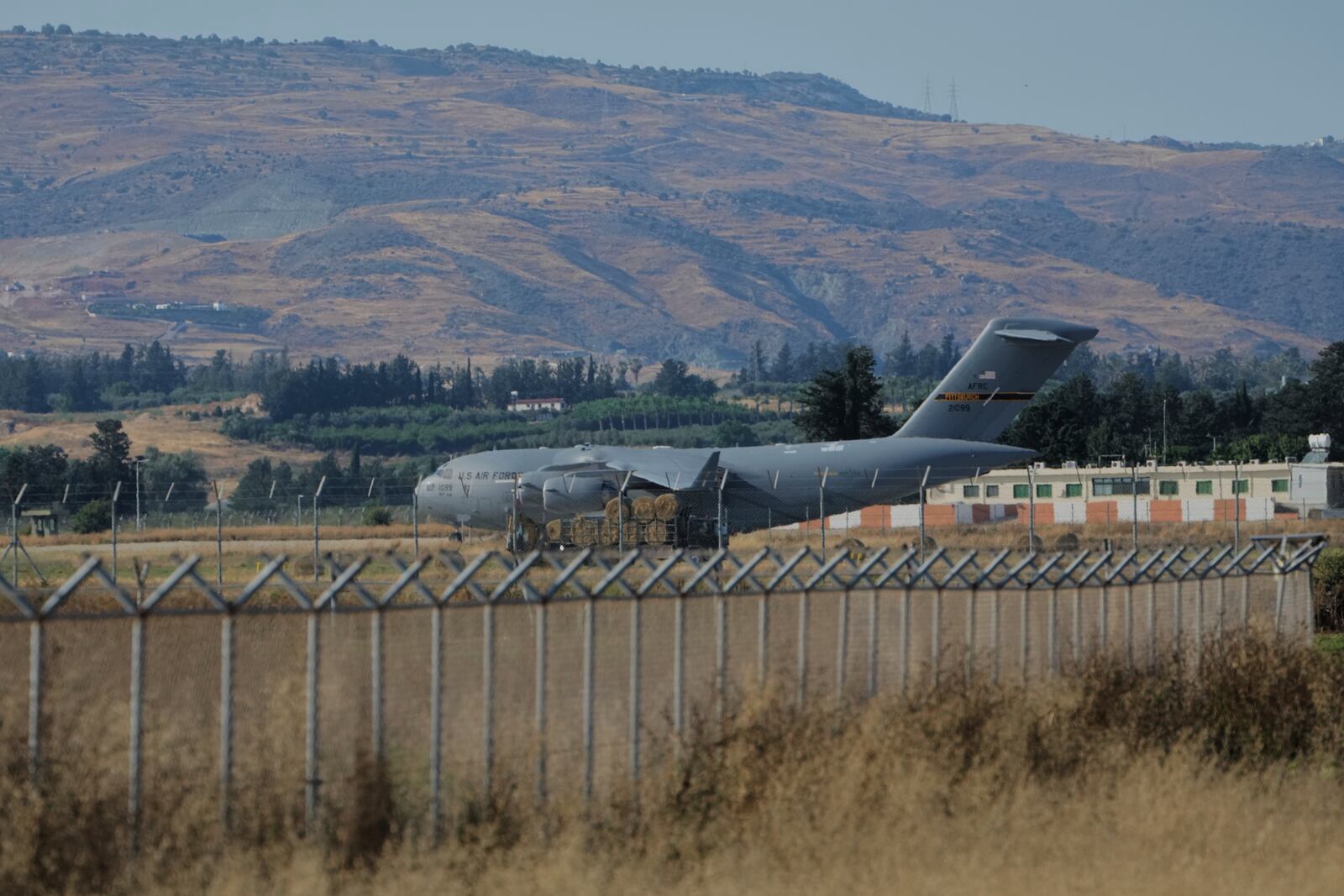 A US Air Force C-17 Globemaster transport aircraft sits on the tarmac of Andreas Papandreou Air Force Base in Paphos, Cyprus, Wednesday, June 18, 2025. (AP Photo/Petros Karadjias)